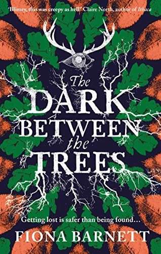 The front cover for The Dark Between the Trees. The title is in the middle of the page, one word in white per line and roots are growing out of the words. Above the worse is an eye with antlers growing out of it. Around the words are green leaves then orange leaves.