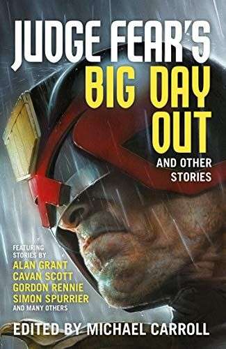 The front cover for Judge Fear's Big Day Out. There is a close up shot of a man with a heavy amoured helmet that protects his eyes. The only part of his face that can be seen is a shaven lantern jaw. The man is looking to the left and it is raining.